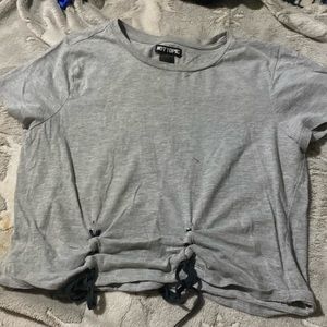 A gray shirt by a hot topic